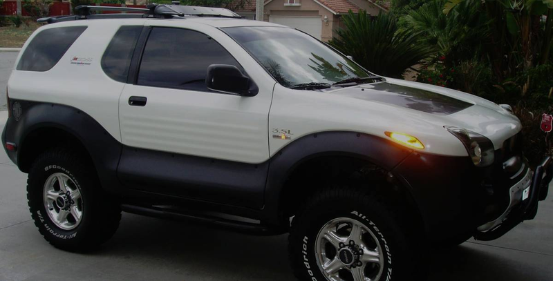 Illustration for article titled For $13,500, This 1999 Isuzu VehiCROSS Could Let You Pretend You're Robert Downey Jr… Or Ozzy Osbourne
